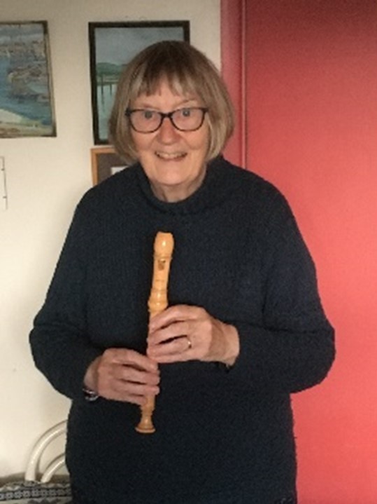 Sarah holding a recorder