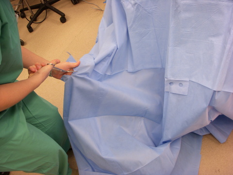 Split drapes used at the head are trimmed to an appropriate length.