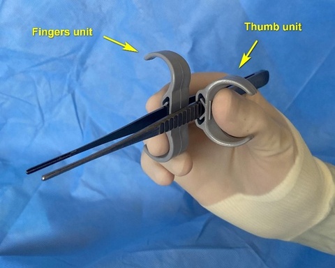 Surgical wings consist of “Thumb” and “Fingers” units that are adjustably positioned on the forceps shafts based on surgeons’ preference. Ergonomic attachment for surgical forceps increases steadiness of manipulations and surgeon’s comfort