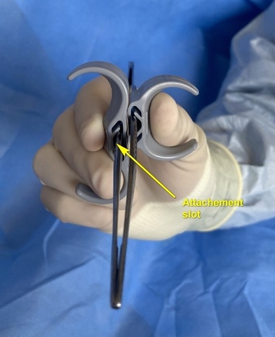 Index finger can be alternatively positioned on top of the attachment slot the ASW device Adjustable ergonomic attachment for surgical forceps with preferred finger position for increased stability comfort during surgery