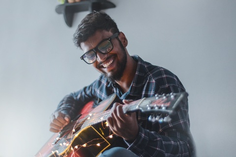 Man playing acoustic guitar