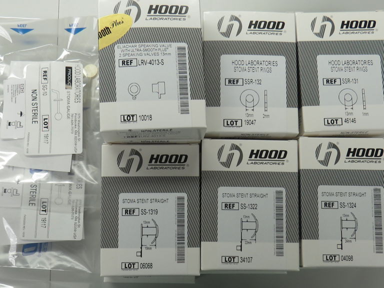 Hood speaking valves, spacers, and stoma stents